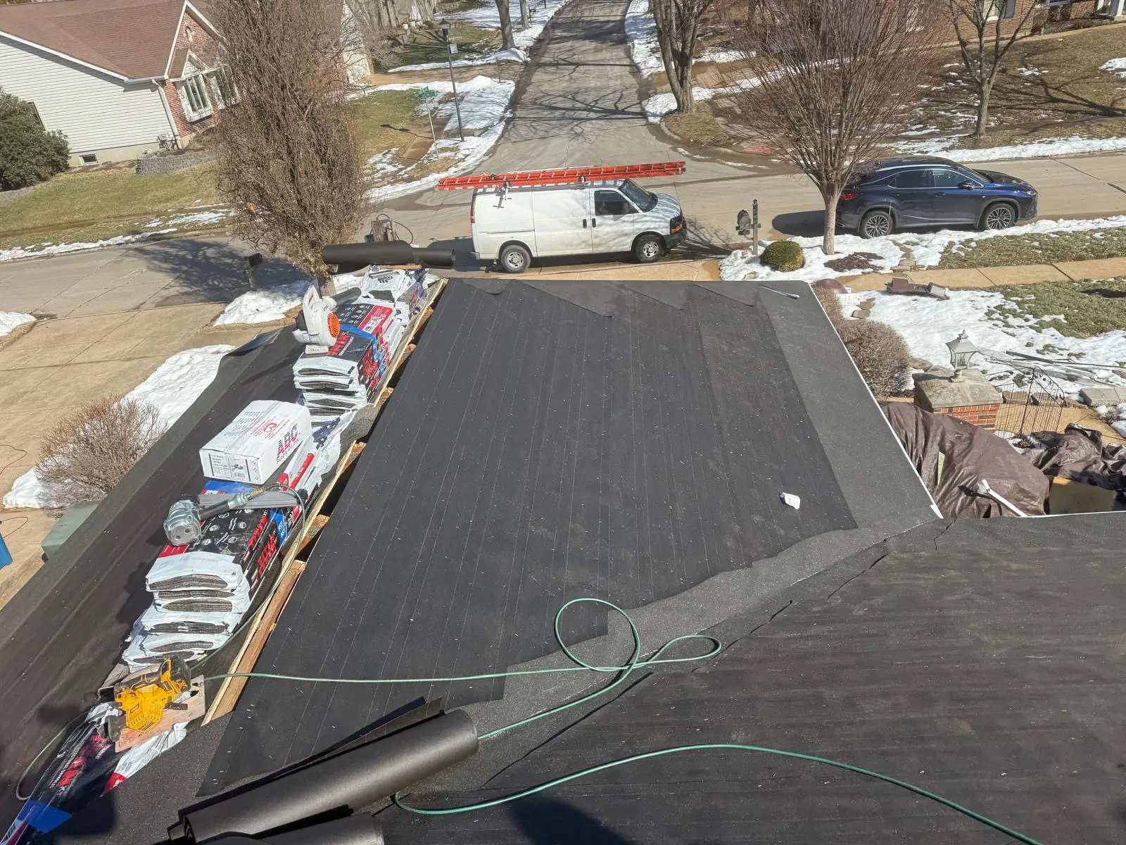 New synthetic underlayment rolled out over the roof deck